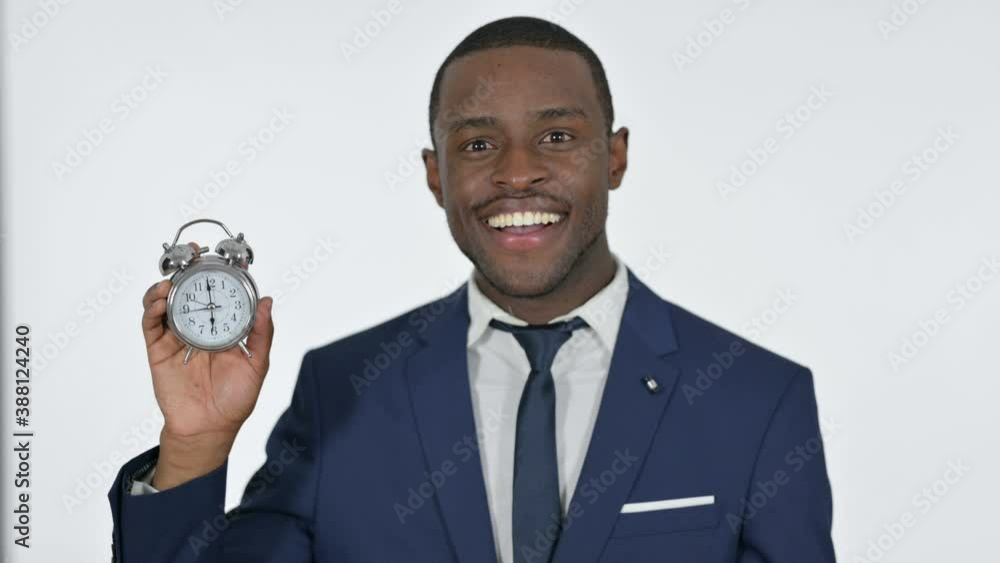 African Businessman Holding a Clock, White Background African Businessman Holding a Clock, White Background