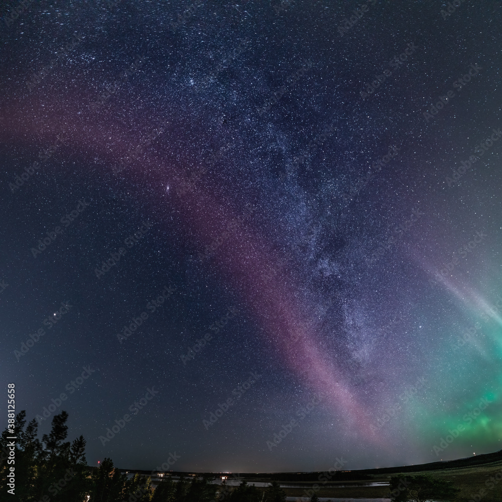 Very rare amazing photo of whole Milky Way panorama with celestial STEVE Phenomenon, green Aurora lights below, Northern Sweden landscape. 23 October 2020, Umea city, Sweden