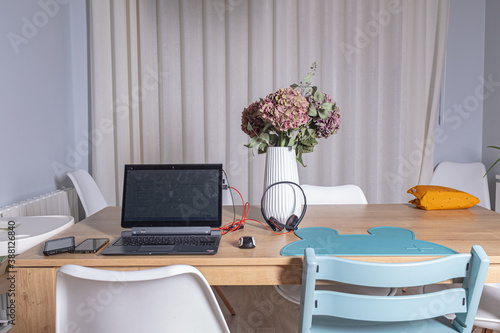 Photography Interior home scene of home working on a family home with laptop and everything