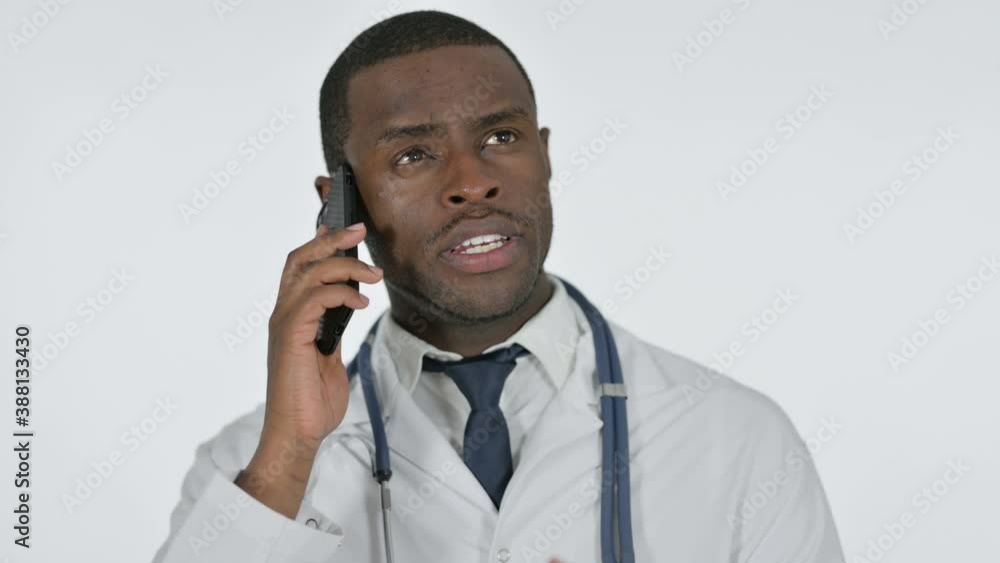 African Doctor Talking on Phone , White Background African Doctor Talking on Phone , White Background