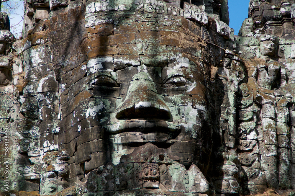 Smiling stone face at east gate of Bayon Temple in Cambodia