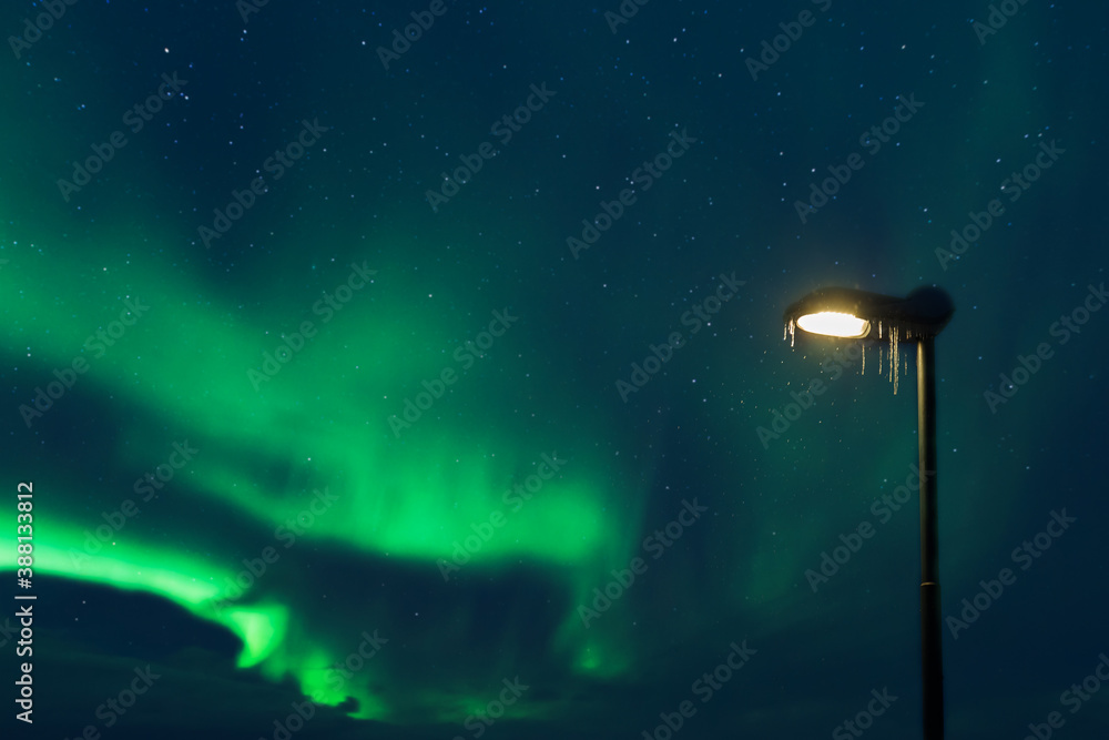 Street lamp and northern lights