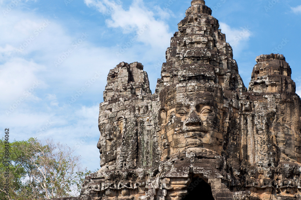 Typical stone faces tower of the Bayon Temple Typical stone faces tower of the Bayon Temple