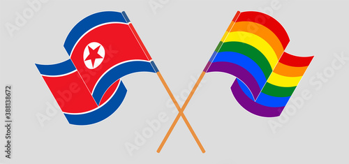Crossed and waving flags of North Korea and LGBTQ