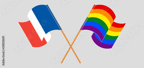 Crossed and waving flags of France and LGBTQ