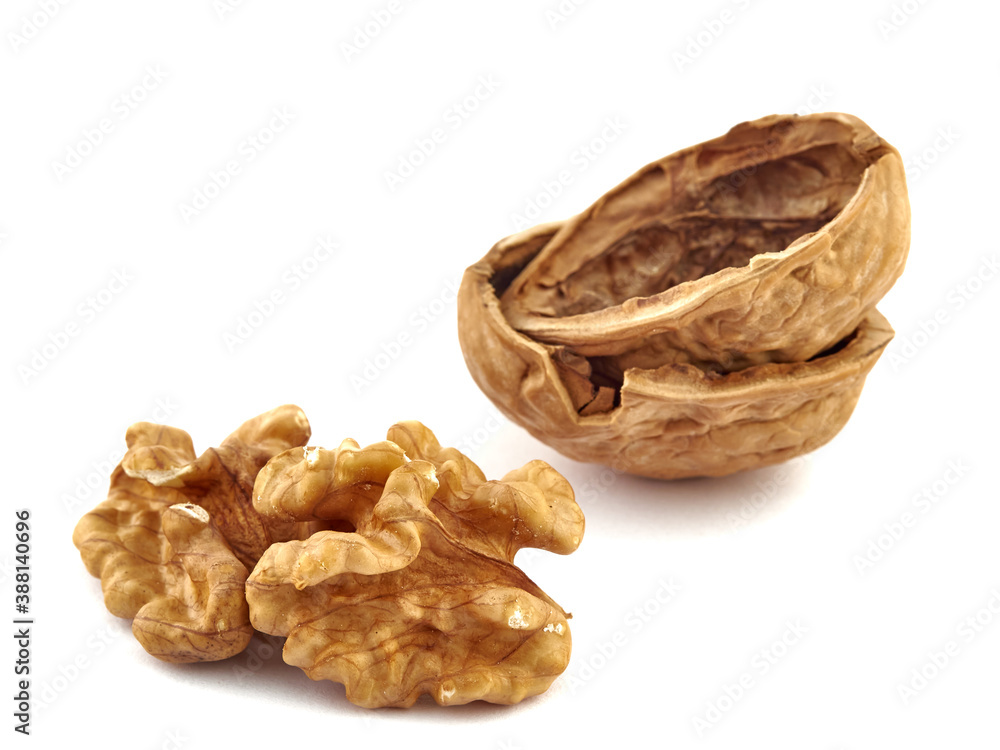 Walnuts and shells lie on a white background.Isolate Walnuts and shells lie on a white background.Isolate