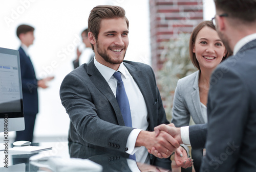 Obraz na plátně happy man introducing businesswoman to business partners