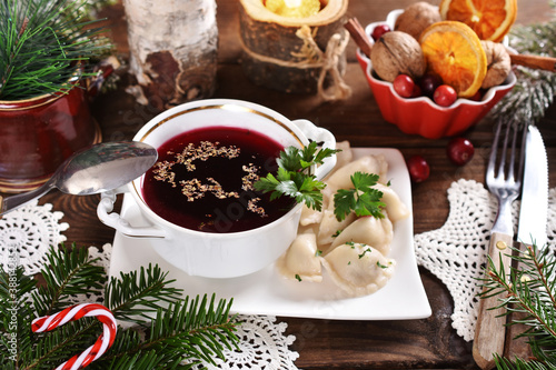 traditional in Poland Christmas Eve  red borscht and dumplings with sauerkraut and mushroom filling