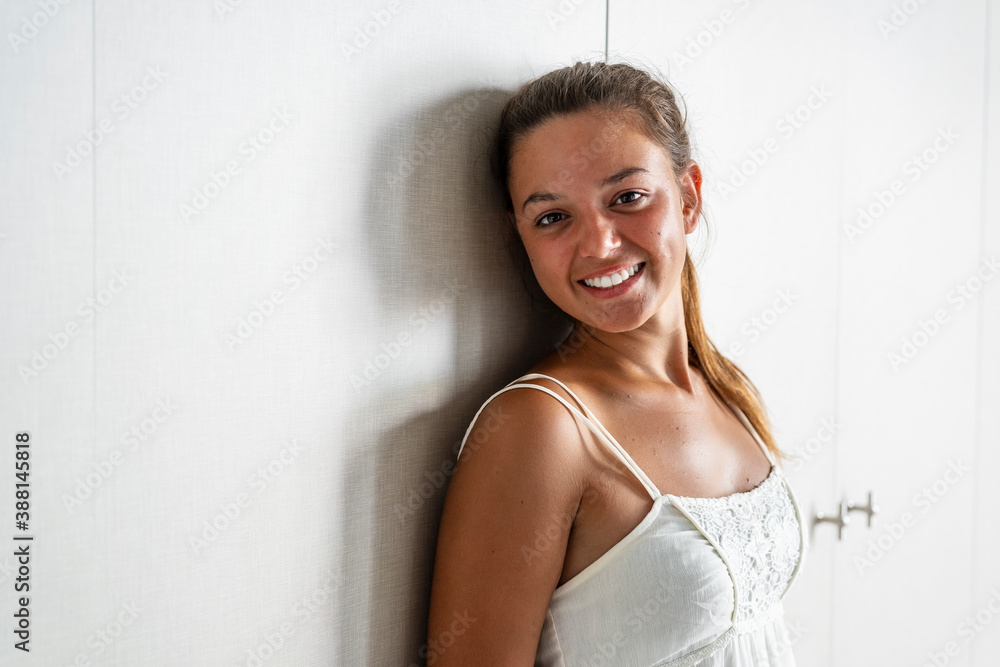 Beautiful smiling woman standing at home