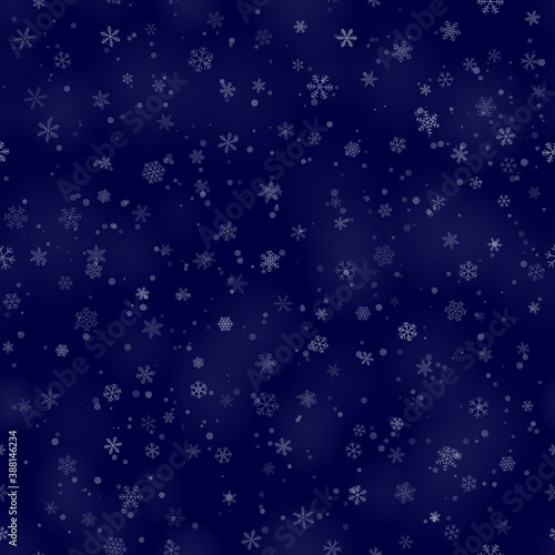 Christmas seamless pattern of snowflakes of different shapes, sizes and transparency, on dark blue background