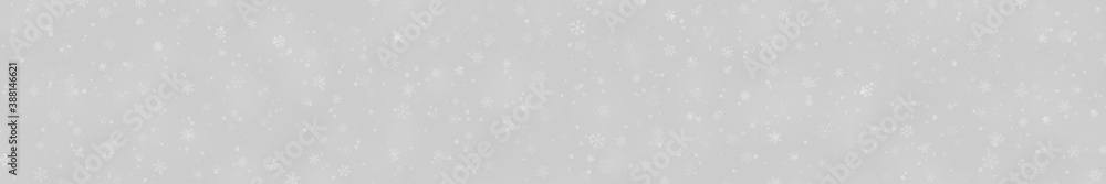 Christmas banner of snowflakes of different shapes, sizes and transparency on gray background