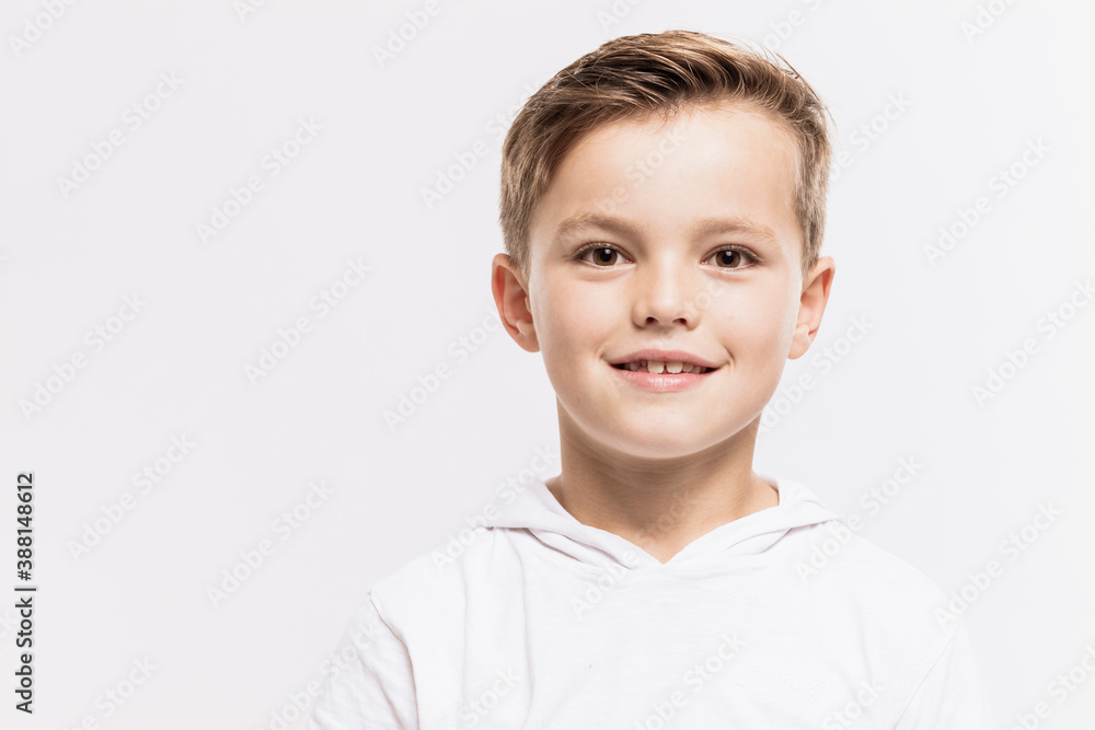 Close-up of cute boy against white background Close-up of cute boy against white background