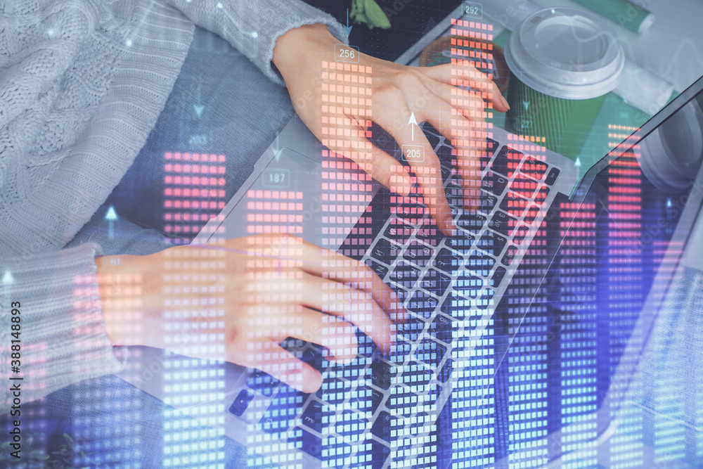 Double exposure of woman hands typing on computer and forex chart hologram drawing. Stock market invest concept. Double exposure of woman hands typing on computer and forex chart hologram drawing. Stock market invest concept.