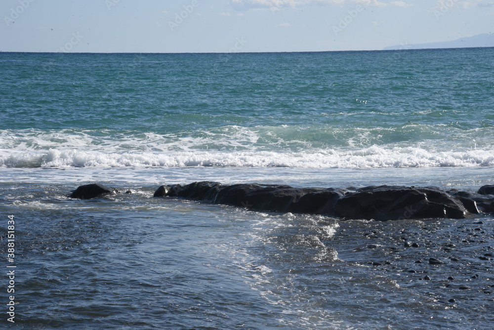 Fototapeta premium White waves on the autumn beach.
