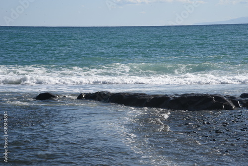 White waves on the autumn beach. © tamu