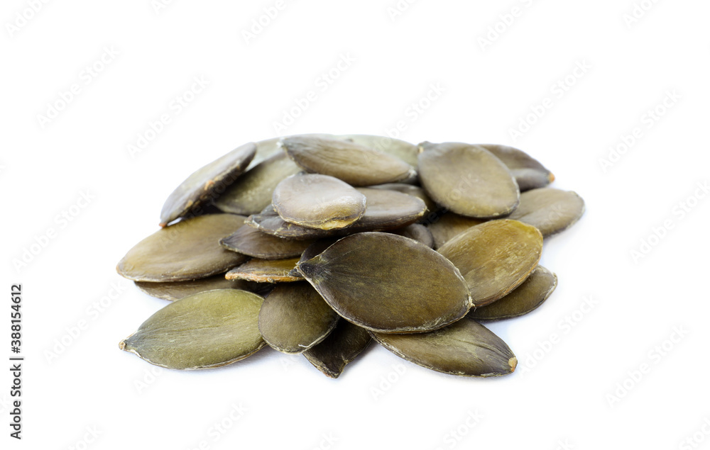 Pile of peeled pumpkin seeds isolated on white Pile of peeled pumpkin seeds isolated on white