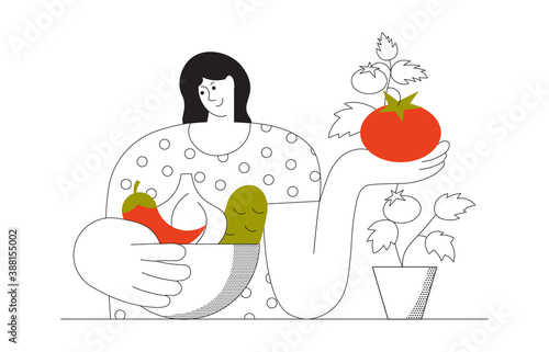 Woman picking vegetables grown at home