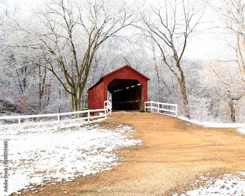 Obraz na plátne Snowy red covered bridge
