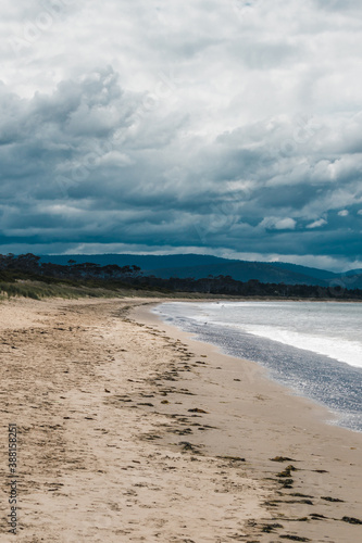 beautiful view of Seven Mile Beach just outside the city of Hobart in Tasmania, Australia on an overcast day with stormy clouds