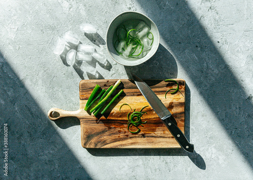 Sliced green onion garnish in ice water photo