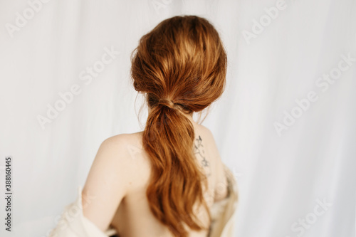 Tender ginger woman with ponytail