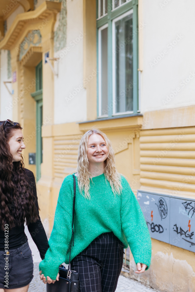 Two young women walking down the street Two young women walking down the street