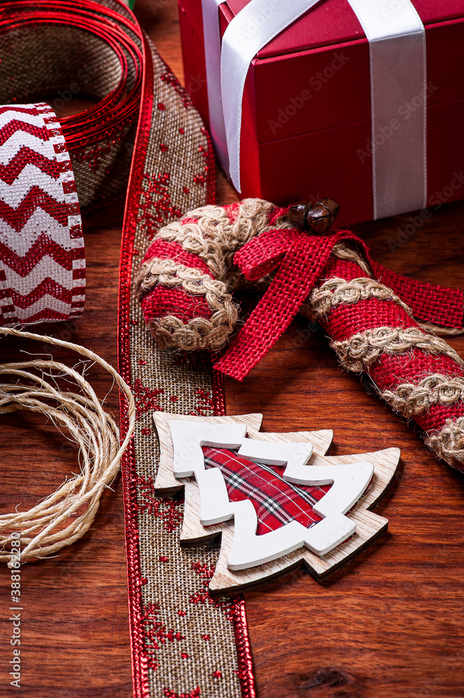Fototapeta premium .Christmas composition on wooden background with ribbons and gifts.Top view. Copy space