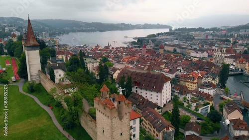 Wallpaper Mural Aerial view around the towers and the Musegg Wall, overlooking the Reuss river cityscape of Luzern, overcast, summer day, in Switzerland - tracking, drone shot Torontodigital.ca
