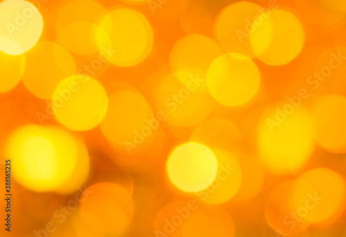 abstract background with bokeh. Abstract background with lights of gold color, close-up.