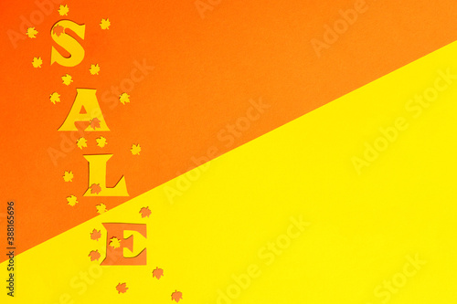 Obraz na plátně paper background divided diagonally by yellow and orange colors on which the wor