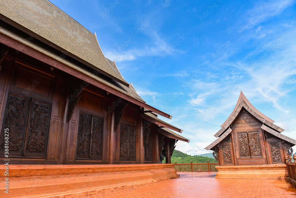 temple beautiful carved in wood with blue sky / temple thailand