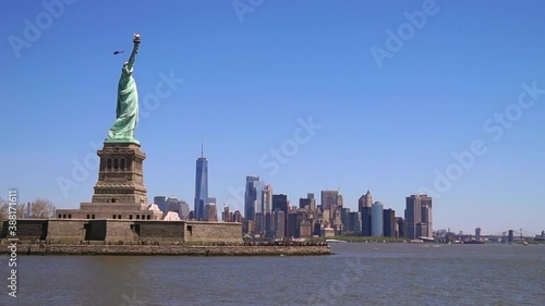 The statue of liberty in New York on a sunny day from the water, NY, USA.