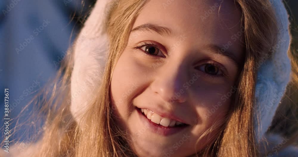 Close up portrait of little beautiful girl with brown eyes and blond hair turns her head to camera and smiles. Close up portrait of little beautiful girl with brown eyes and blond hair turns her head to camera and smiles.