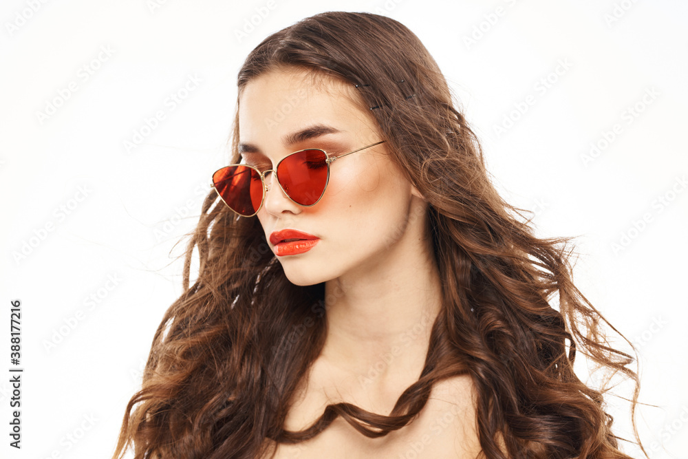 Fashionable brunette in sunglasses with makeup lipstick model Fashionable brunette in sunglasses with makeup lipstick model