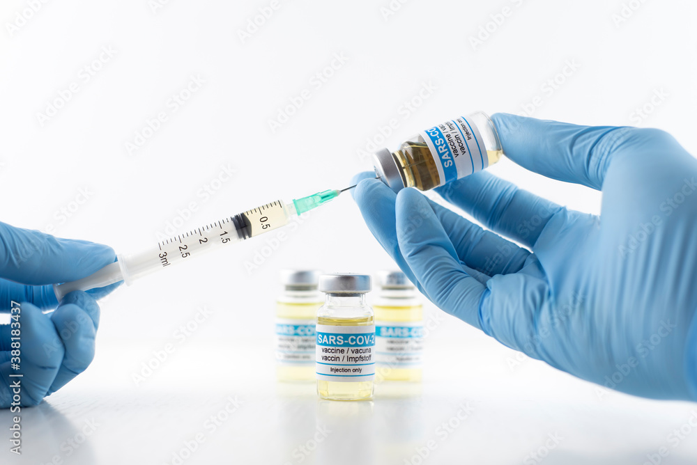 doctor with syringe and vaccine doctor with syringe and vaccine