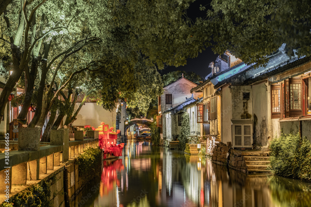 Night view of the river and architecture in Zhouzhuang, an ancient Chinese village in Jiangsu province, China.