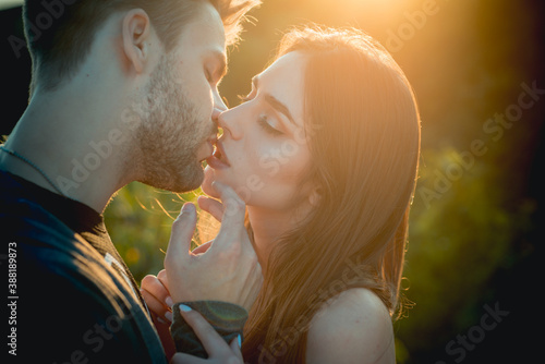 Romantic kiss. Lovely couple of lovers kissing. photo