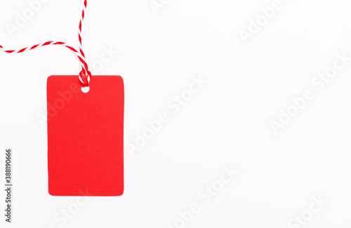 On a white background red blank price tag. Sale. Place to insert your text or advertisements. Marketing concept