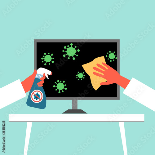 Hand holding sanitizer bottle spraying on computer and the other hand cleaning computer. Disinfect germs, bacteria and Covid-19 Coronavirus. Healthcare  concept.	