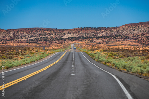Panoramic skyline with empty road. Long Desert Highway California.
