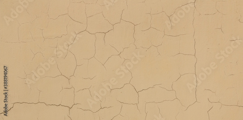 Abstract background of an old wall, plaster texture with cracks