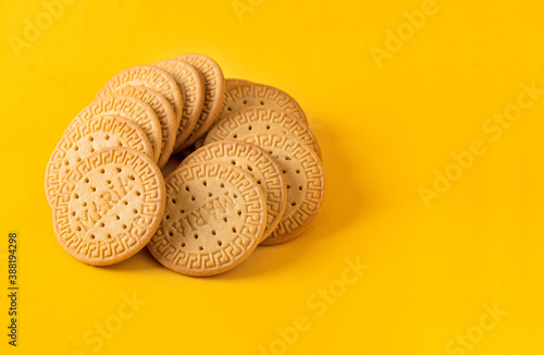 Photo Many Marie biscuits  on bright yellow background