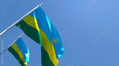 The national flag of Rwanda flutters in the wind photo