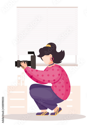 The girl sitting and adjusting the long lens. Photographic art. A woman prepares camera for a photo shoot. Photographer with camera takes picture in the photo studio on the white background