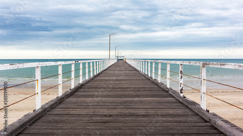 Fototapeta Naklejka Na Ścianę i Meble -  The old largs bay jetty on an overcast day with no people in adelaide south australia on october 26th 2020