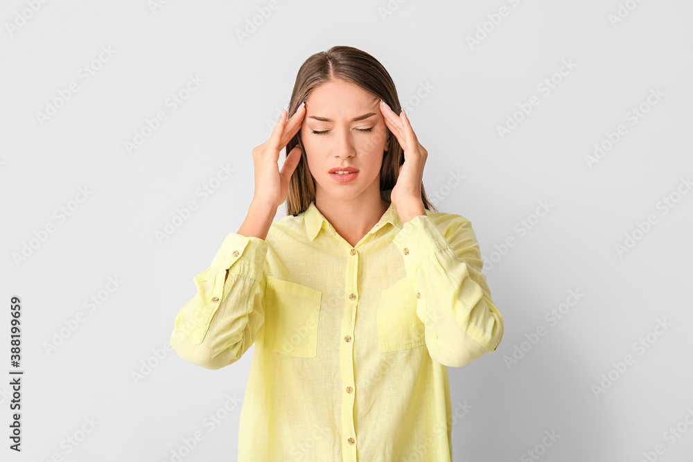 Stressed young woman on light background Stressed young woman on light background