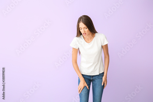 Woman with problem of limbs numbness on color background. Diabetes symptoms