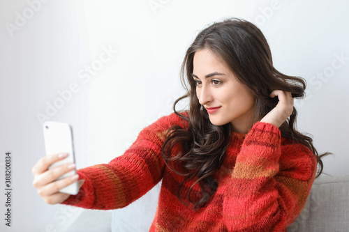 Beautiful young woman takin...
