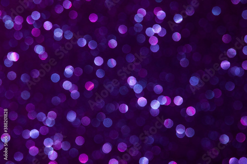 Abstract purple violet color dots defocused bokeh background. Holiday festive concept. 