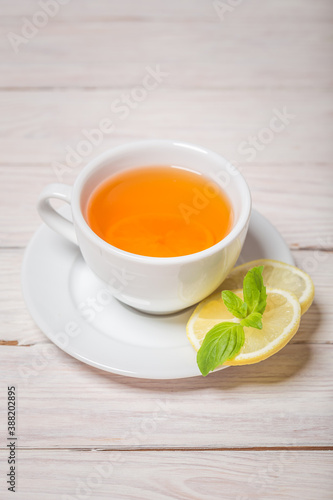 Ginger tea with mint, lemon and honey. Homemade warming tea for colds and flu.